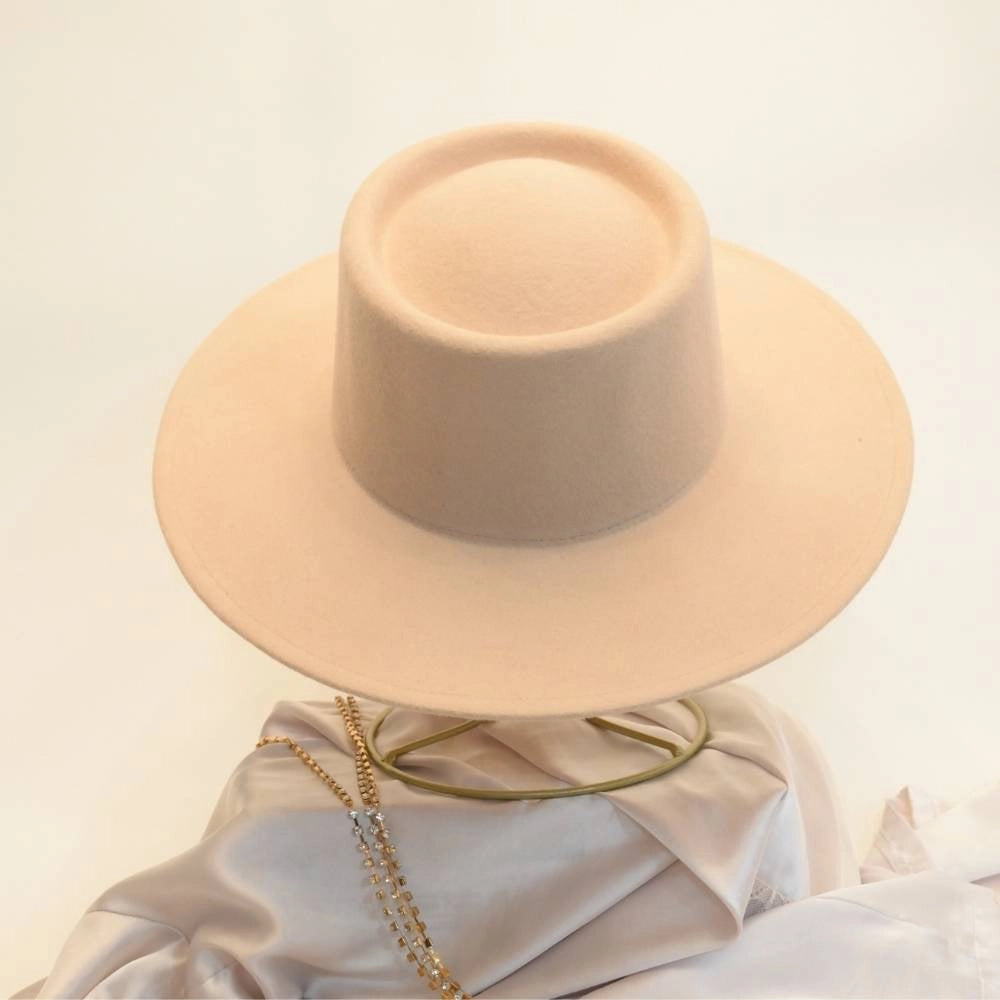 Back view of beige beauty satin lined wool boater hat.