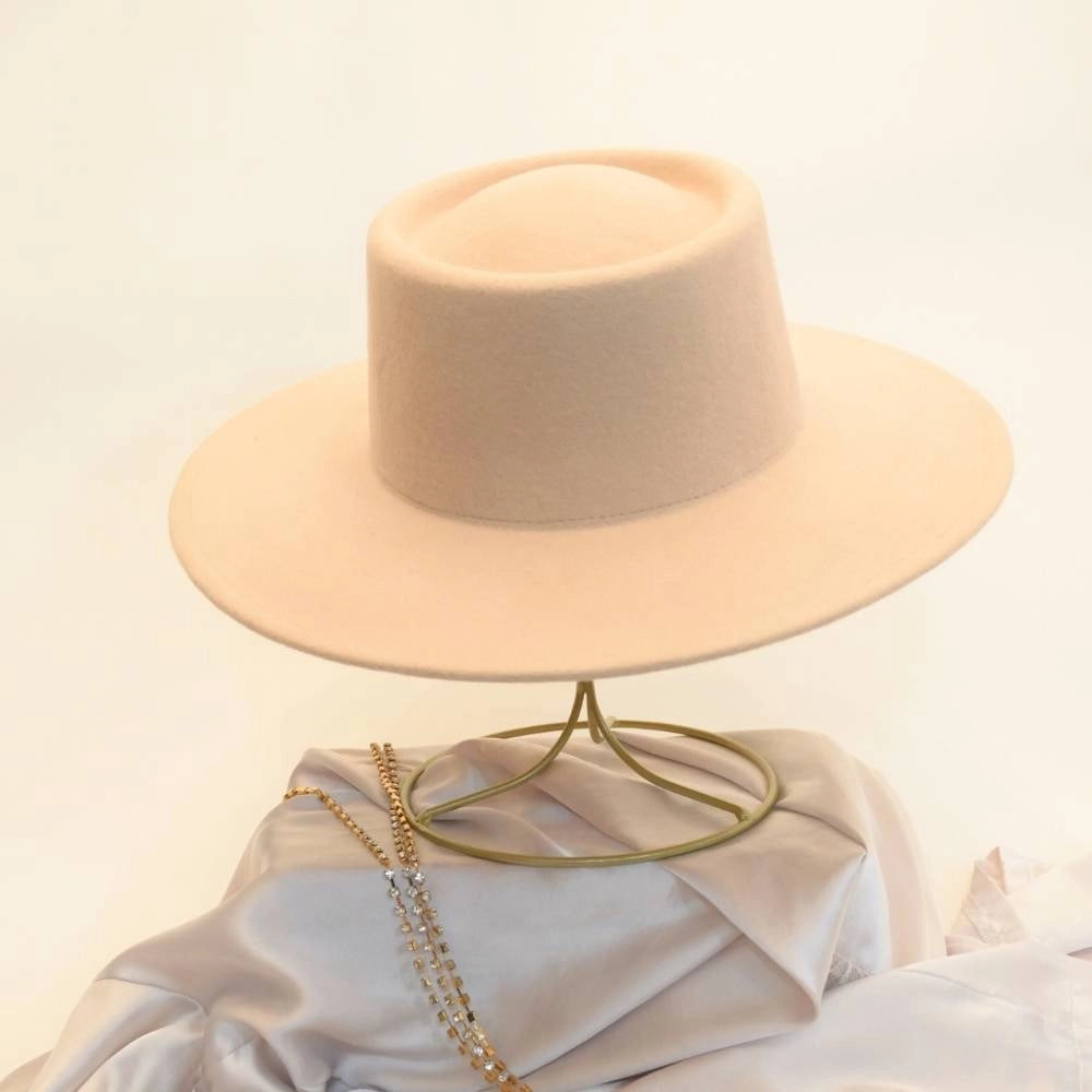 Front view of beige beauty satin lined wool boater hat.