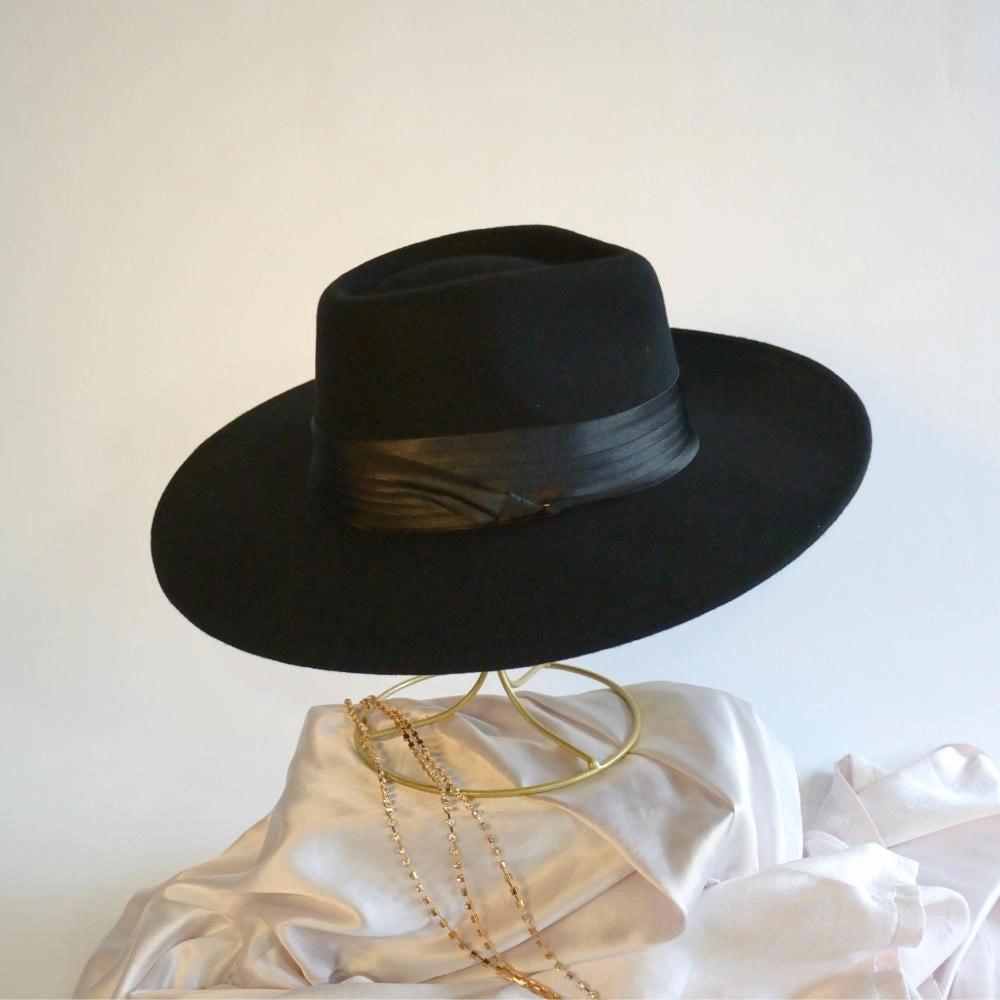 A side view of the midnight satin hat band on the ebony crown black fedora.