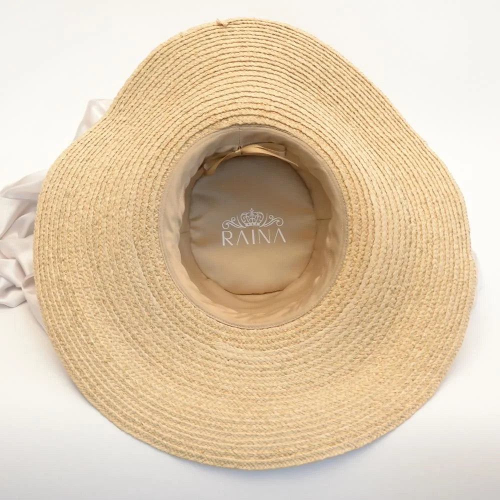 Inside view sunlit dream satin lined wide brimmed raffia sun beach hat.